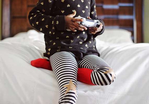 child-playing-games-bedroom-joystick-star